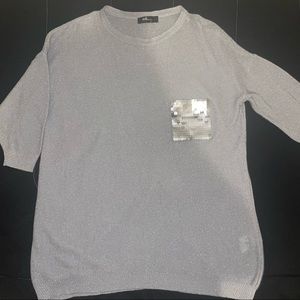 Woman’s gray/sliver blouse